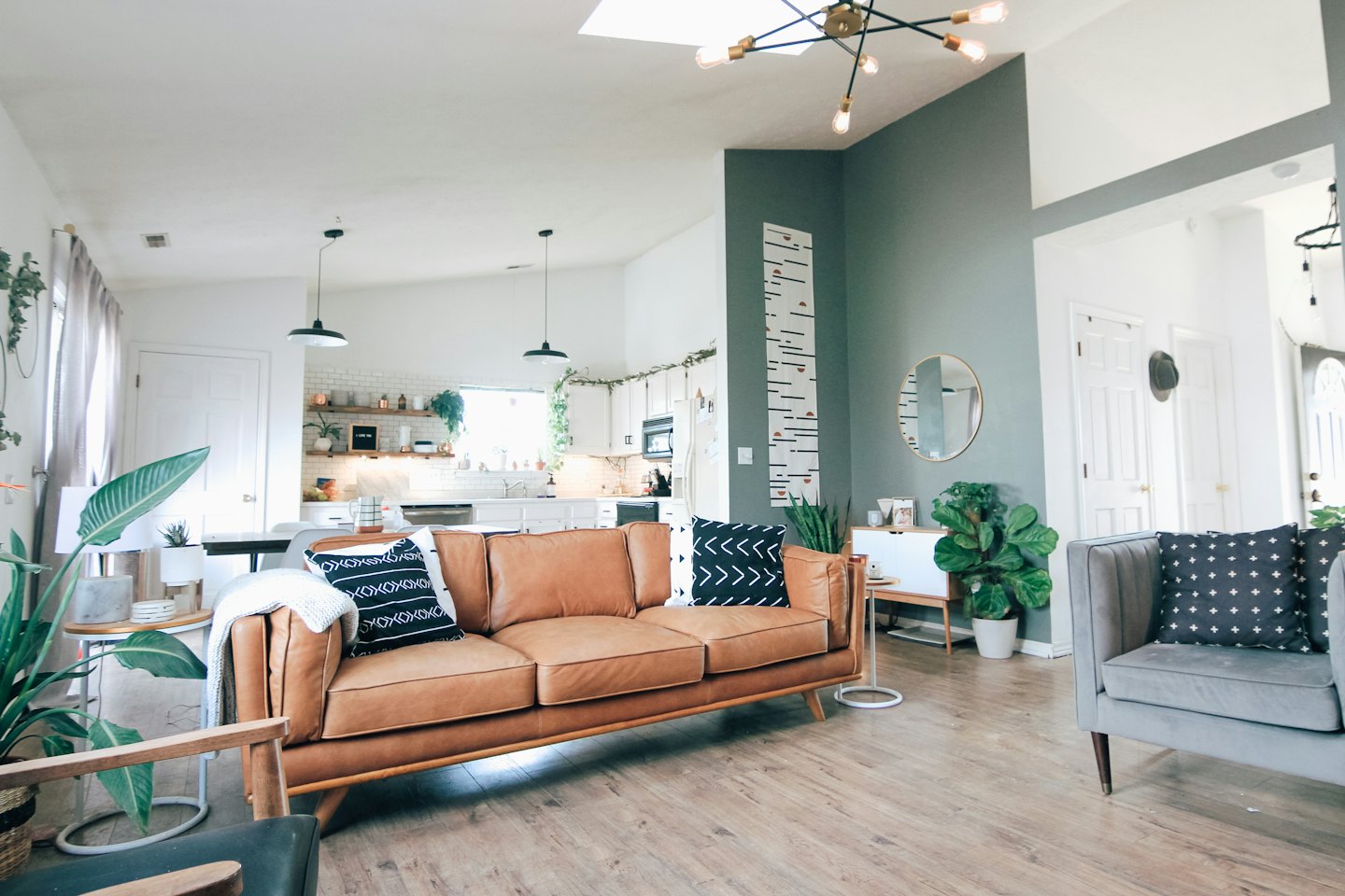 Open plan living room and kitchen with modern furnishings.